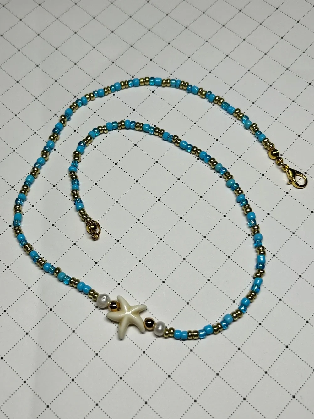 Baby Blue Starfish Necklace with Gold Accents